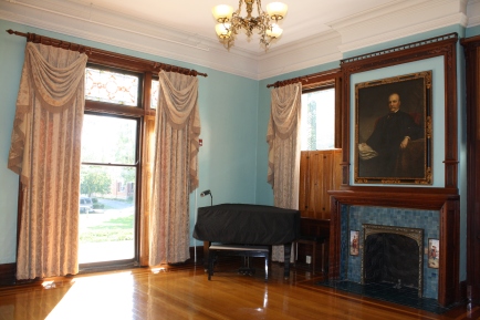 The formal sitting room and portratit of D.D. Bell.