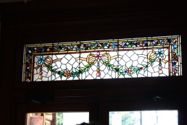 The transom above the front door is leaded glass representing garlands of flowers and leaves