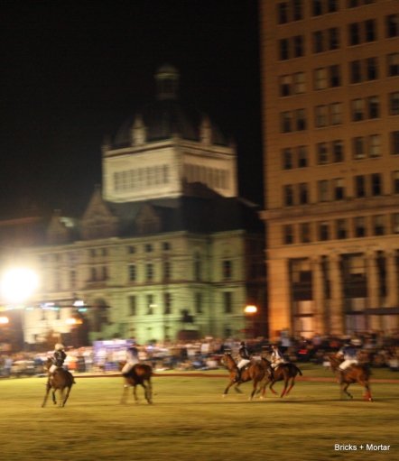 Lexington's historic courthouse and first "sky scraper" loom over the players.